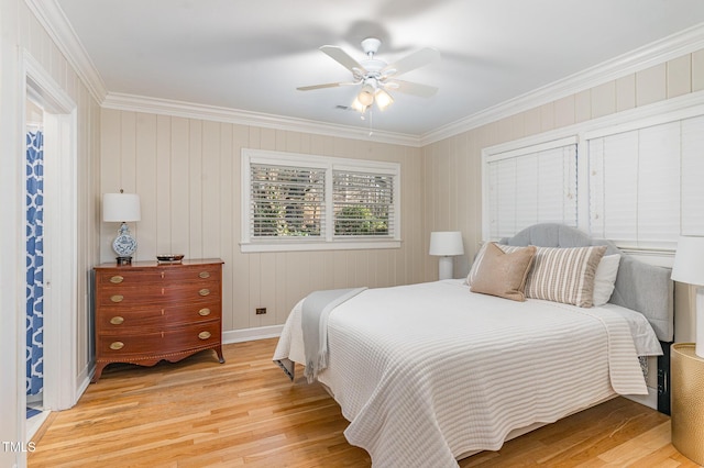 bedroom featuring wood-type flooring, ceiling fan, and crown molding