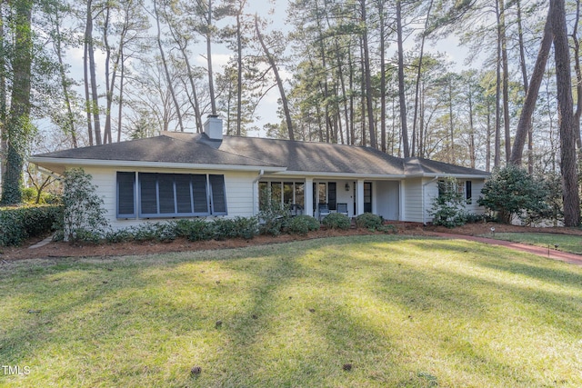 single story home with a front yard and a porch