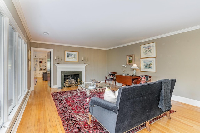 living room featuring crown molding and hardwood / wood-style floors