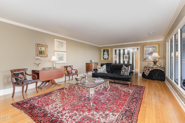 living room with hardwood / wood-style floors and crown molding