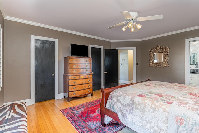 bedroom featuring hardwood / wood-style flooring, ornamental molding, connected bathroom, and ceiling fan