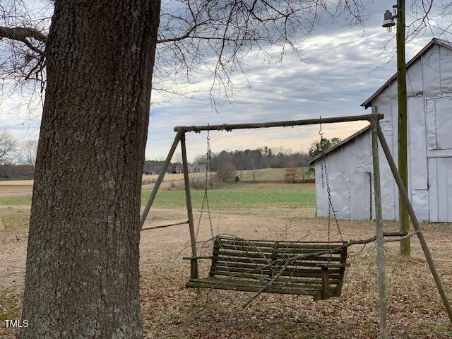 view of yard with a rural view