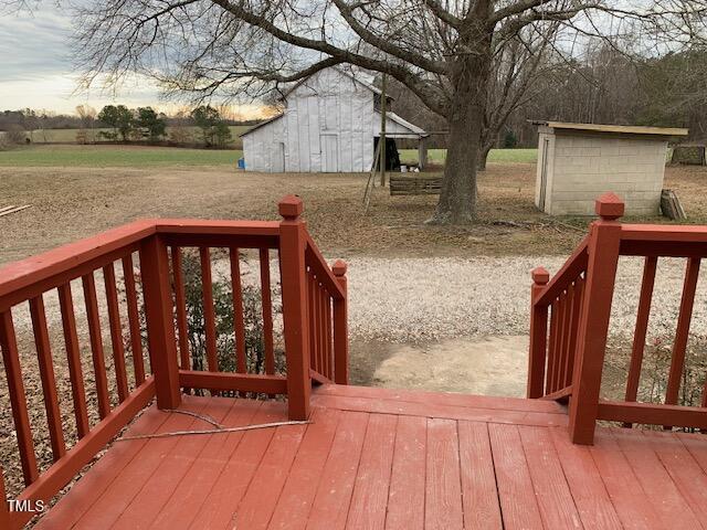 deck at dusk with a storage unit