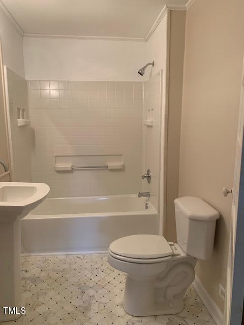 bathroom featuring  shower combination and toilet