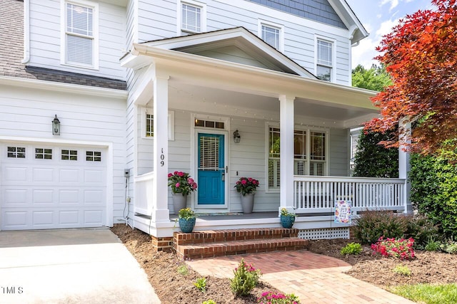 property entrance with a garage and covered porch