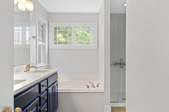 bathroom with plus walk in shower and vanity