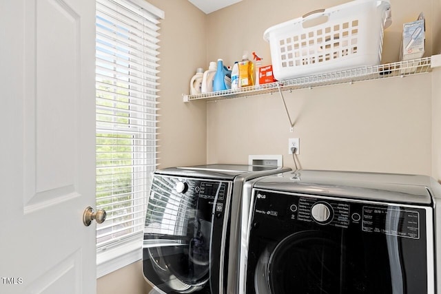 laundry room with washer and dryer