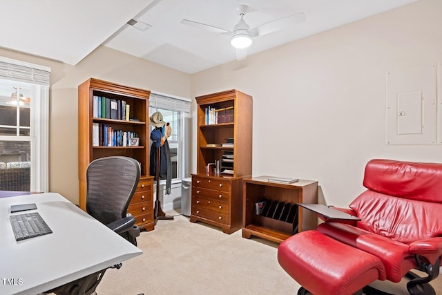 carpeted office with electric panel and ceiling fan