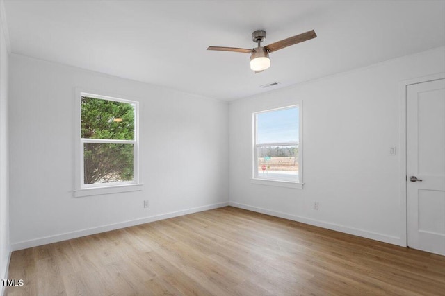 unfurnished room with ceiling fan and light wood-type flooring