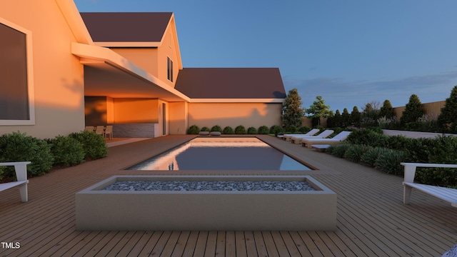 outdoor pool featuring a fire pit, a deck, and an in ground hot tub