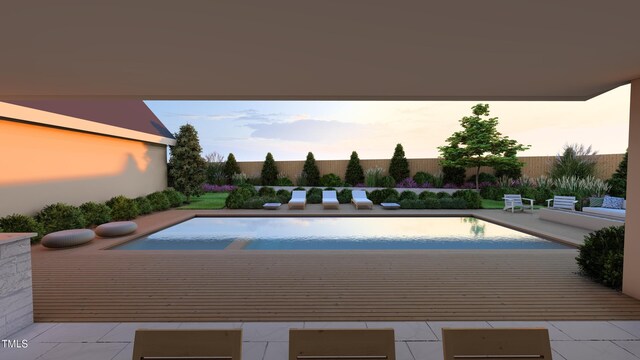 pool at dusk featuring fence, a fenced in pool, and a patio area