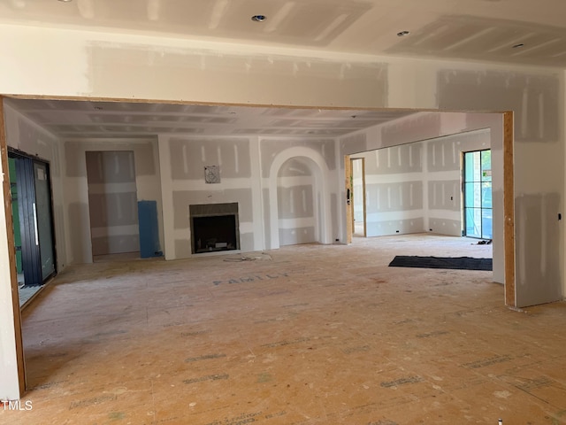 214 Reynolds Rd, Raleigh, NC 27609 - unfurnished living room with a fireplace