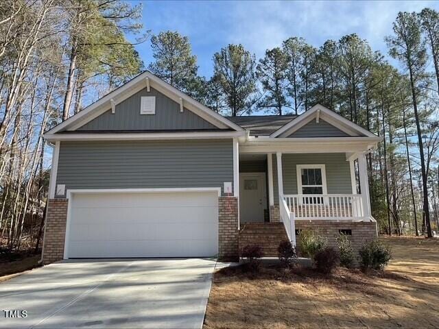 craftsman-style house with a garage and covered porch