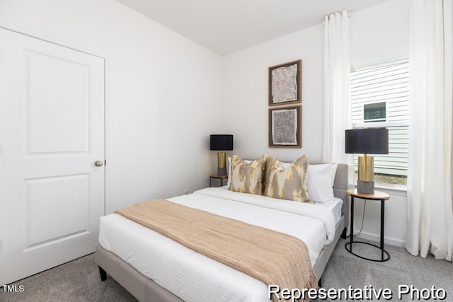 bedroom with light colored carpet