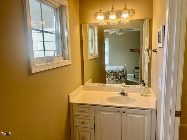 bathroom featuring connected bathroom, vanity, and ceiling fan