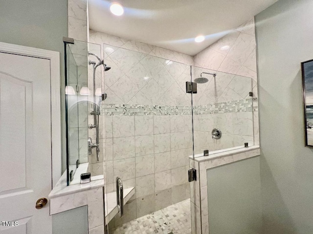 bathroom with a shower stall