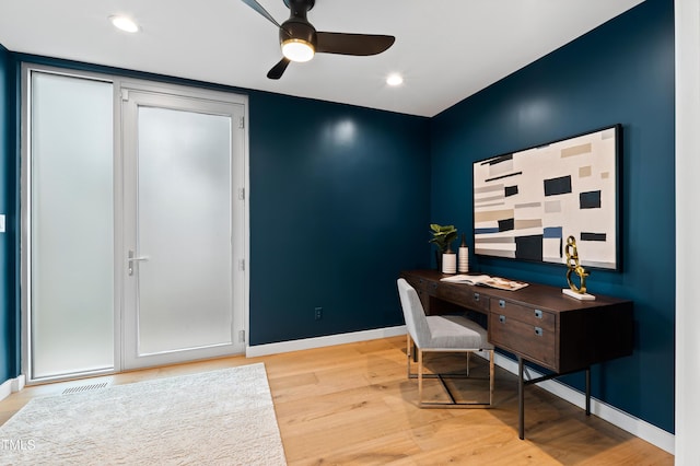 office area with light hardwood / wood-style floors and ceiling fan