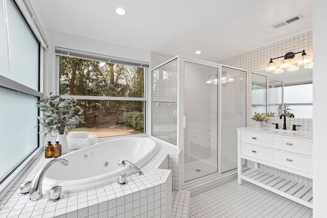 bathroom featuring vanity, separate shower and tub, and tile patterned flooring