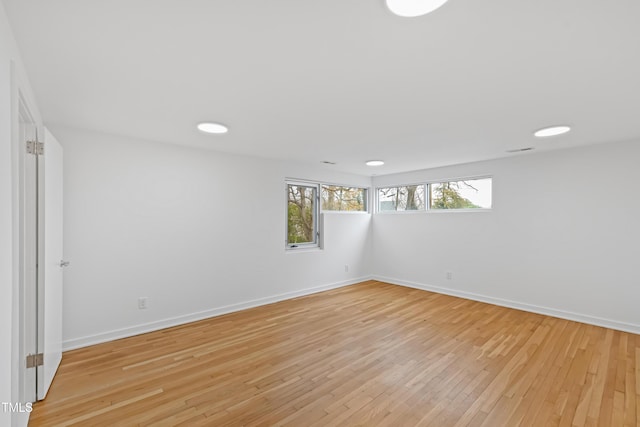 spare room with light wood-type flooring