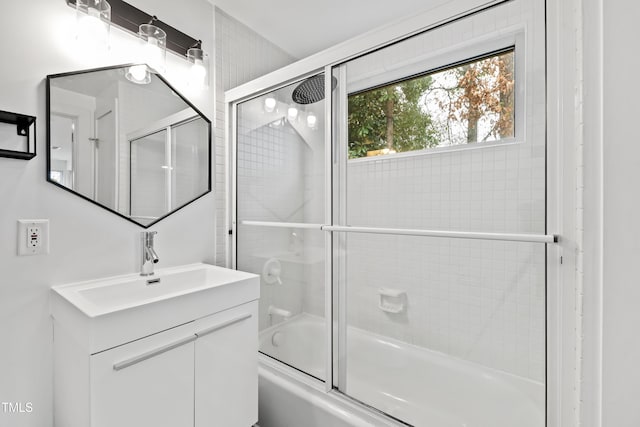 bathroom featuring vanity and enclosed tub / shower combo