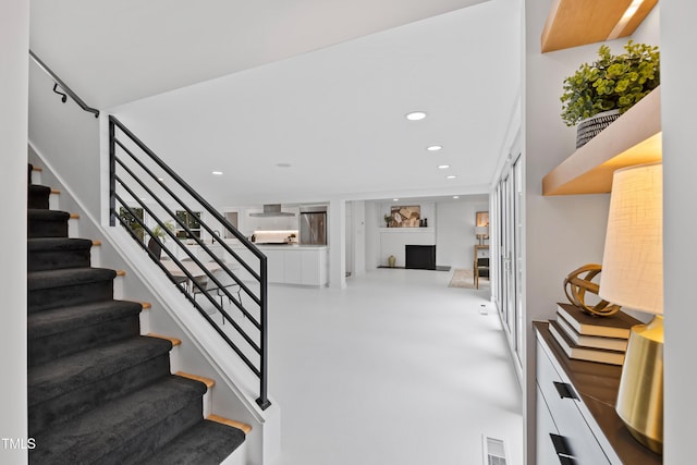 stairway with concrete floors