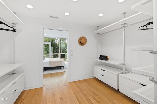 spacious closet featuring light wood-type flooring