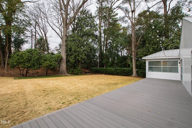 wooden terrace with a yard