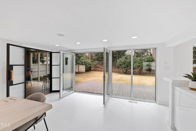 doorway to outside with concrete floors