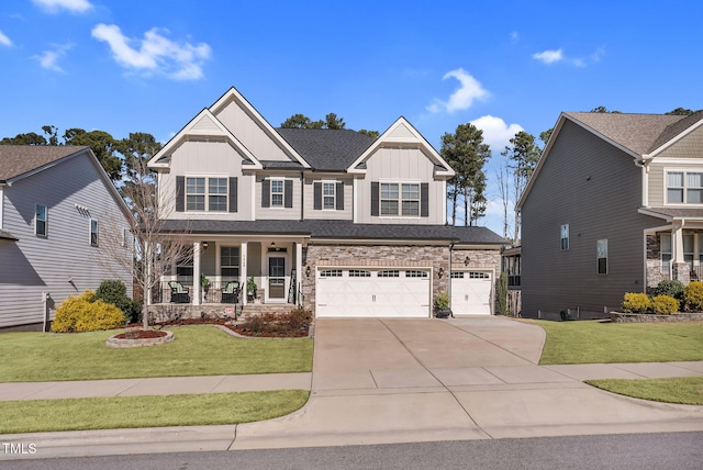 craftsman inspired home with a porch, concrete driveway, an attached garage, board and batten siding, and a front lawn