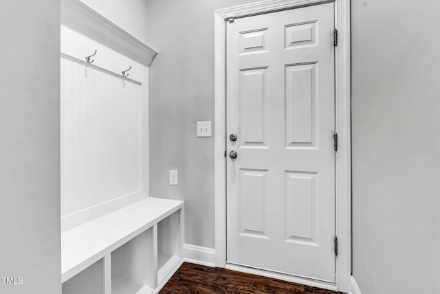 mudroom featuring dark wood-style floors and baseboards