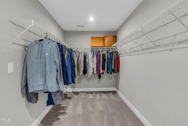 spacious closet featuring carpet floors and visible vents