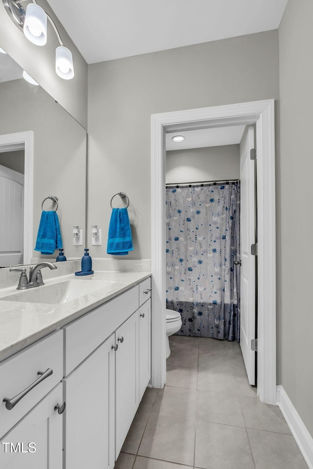 bathroom with tile patterned flooring, a shower with curtain, vanity, and toilet