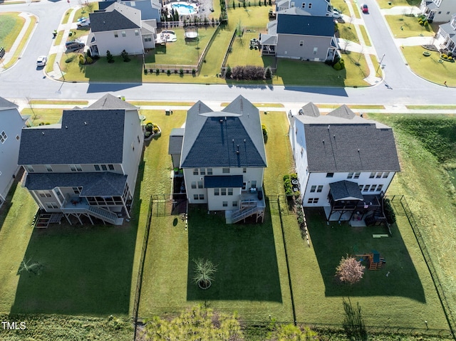 birds eye view of property with a residential view