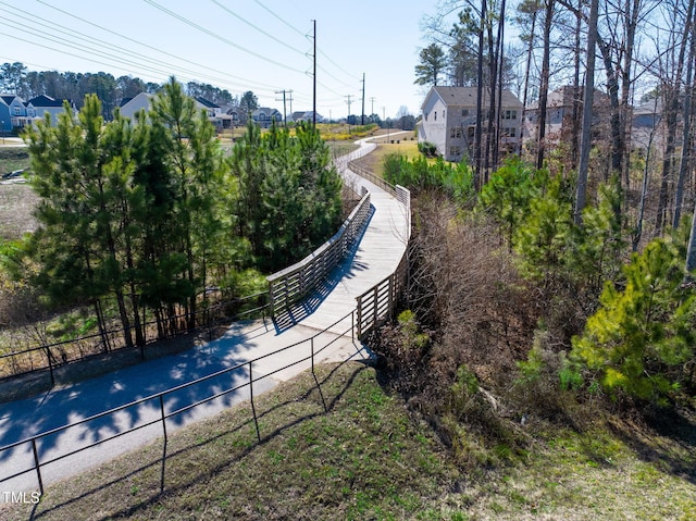 view of property's community with fence