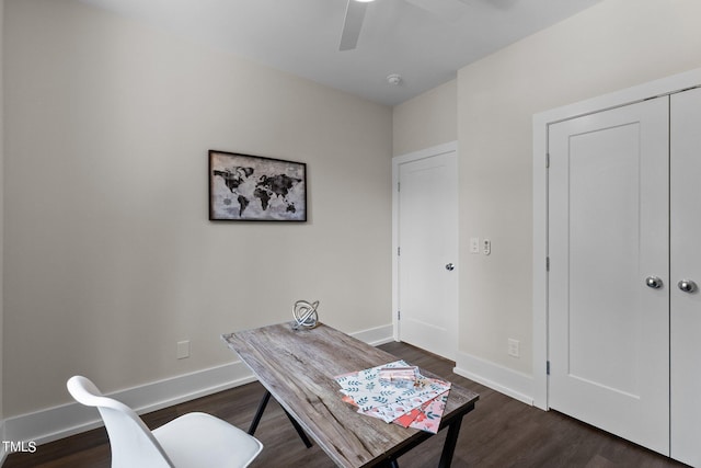 office space featuring dark wood-type flooring and ceiling fan