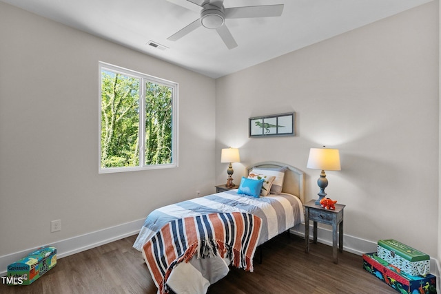 bedroom with dark wood-type flooring and ceiling fan