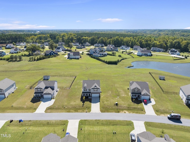 bird's eye view with a residential view and a water view