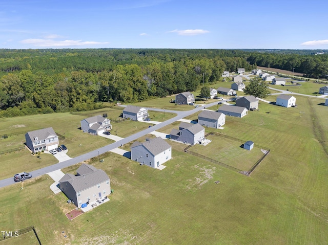 bird's eye view featuring a forest view