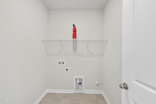 clothes washing area featuring laundry area, hookup for an electric dryer, baseboards, and washer hookup