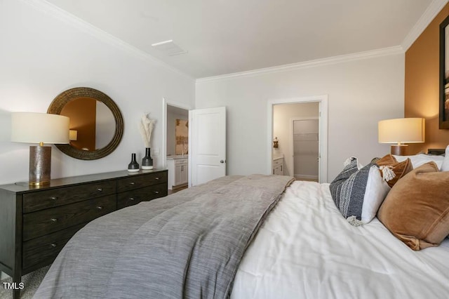 bedroom featuring ornamental molding and connected bathroom