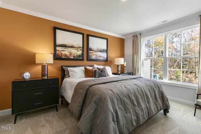 carpeted bedroom featuring crown molding