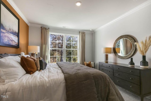 carpeted bedroom with ornamental molding