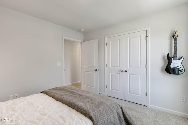 carpeted bedroom featuring a closet