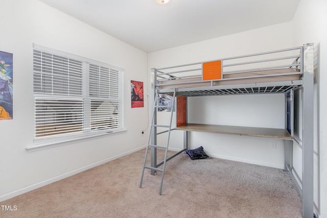 bedroom featuring light colored carpet