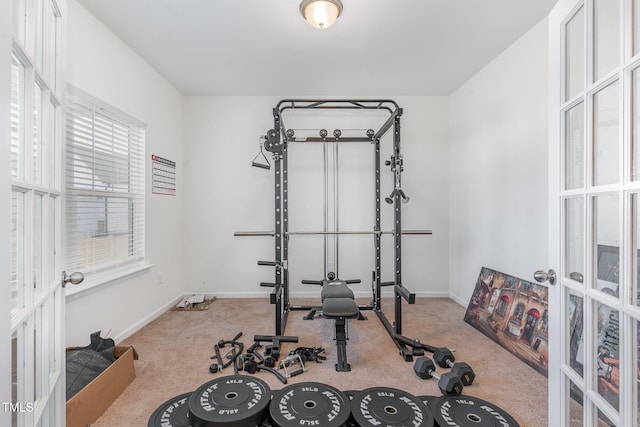 workout area with french doors and carpet flooring