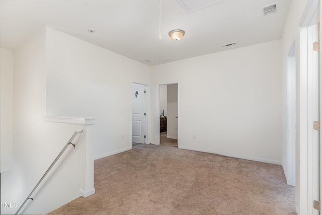 empty room with light colored carpet