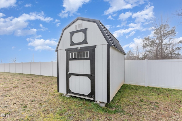 view of outdoor structure featuring a lawn