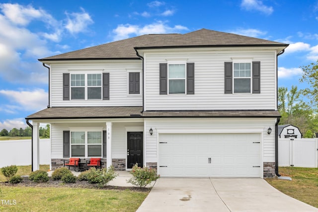 108 Bonnie Girl Ct, Lillington, NC 27546 - view of front of property with a porch, fence, stone siding, and concrete driveway