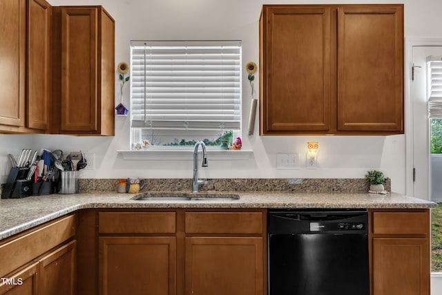 108 Bonnie Girl Ct, Lillington, NC 27546 - kitchen with a sink, light countertops, black dishwasher, and brown cabinets