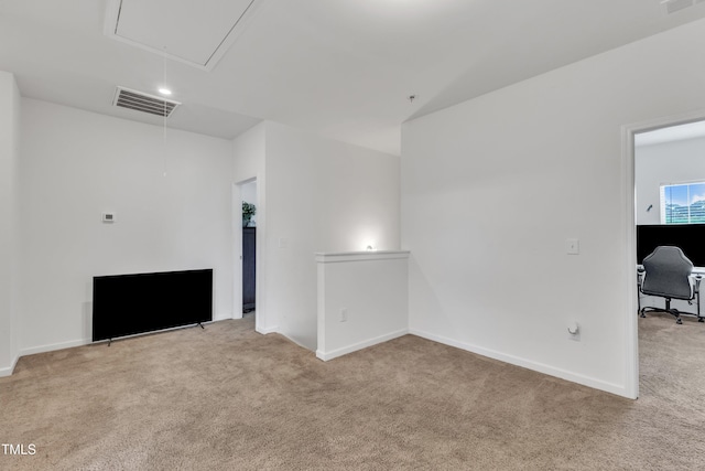 108 Bonnie Girl Ct, Lillington, NC 27546 - unfurnished living room featuring visible vents, baseboards, attic access, and carpet floors